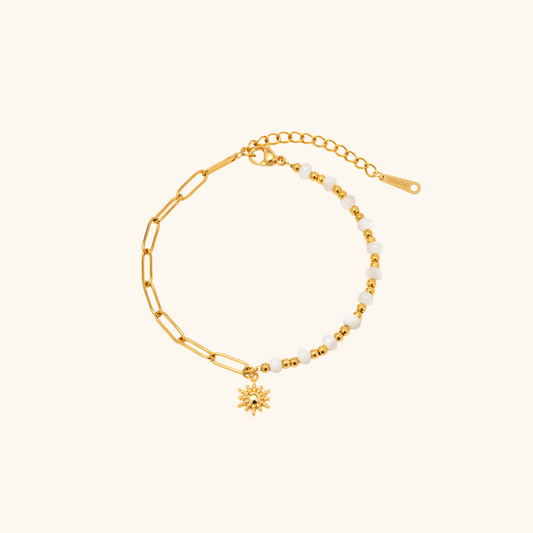 Bracelet deux faces perles et maillot avec pendentif soleil doré